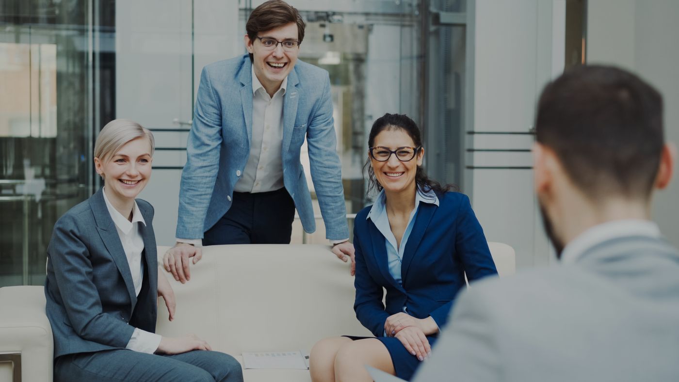 Professionals smiling together in a meeting