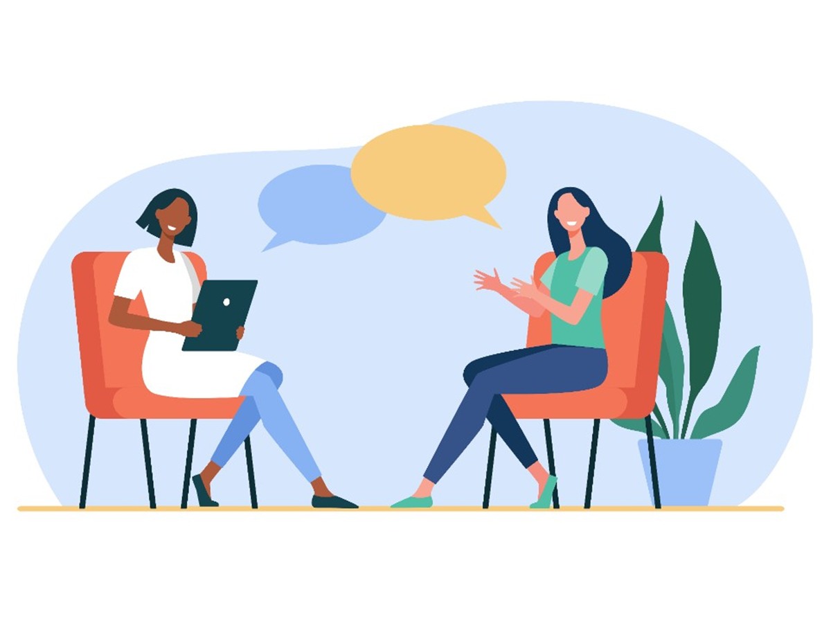 Two people talking during a consultation