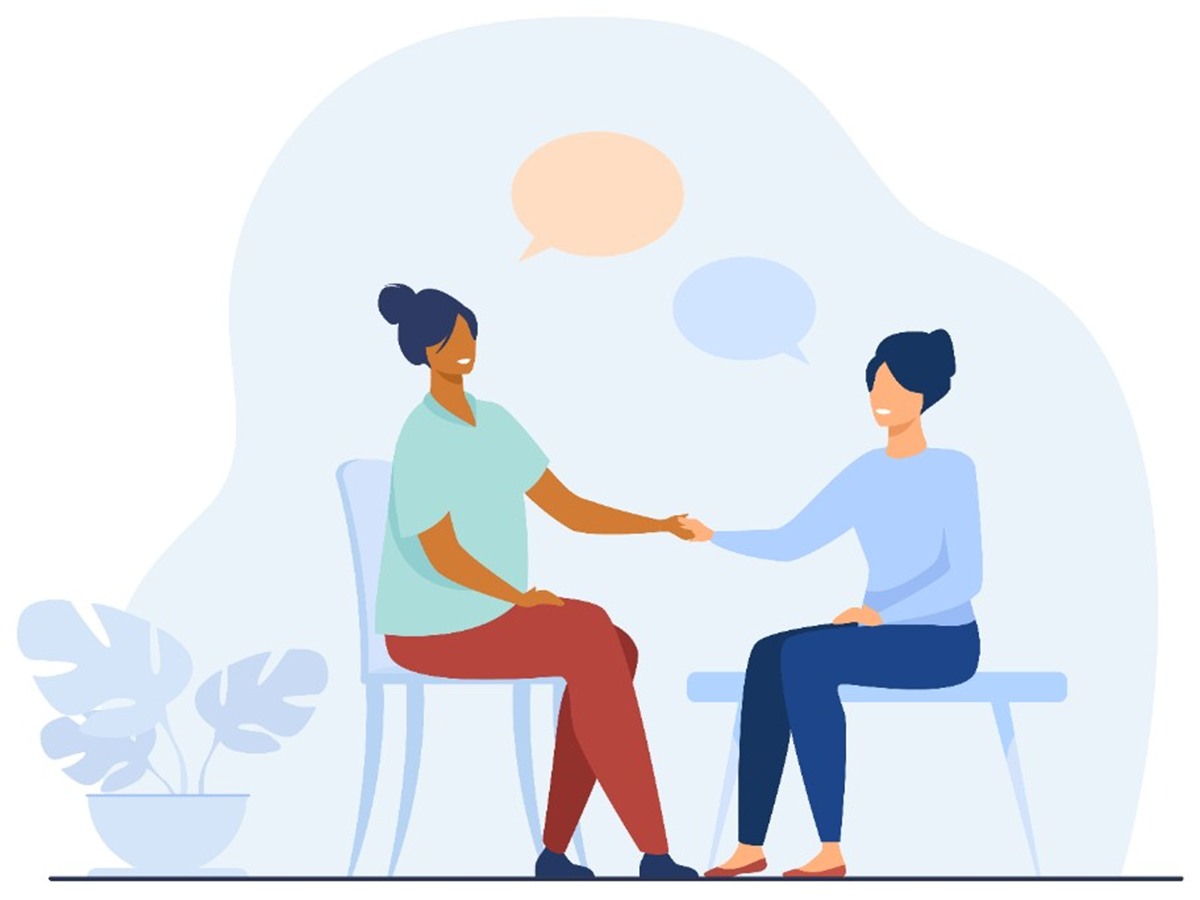 Two people talking during a meeting